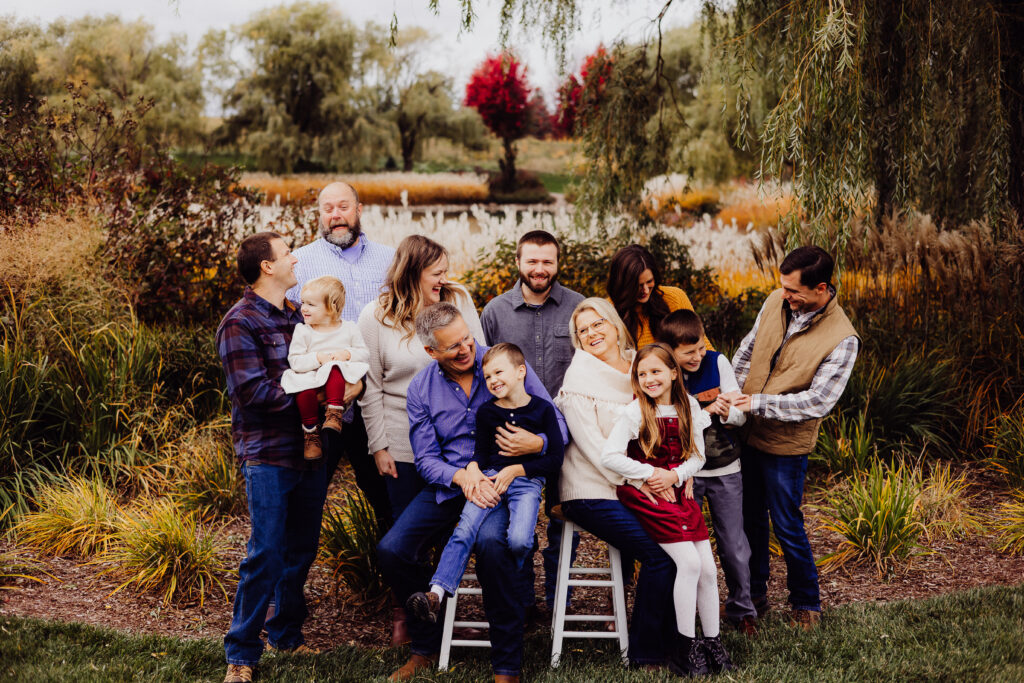 Candid Roe family photo in Sheboygan, WI with multiple generations laughing together during fall family session.